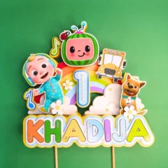 Multicolored cocomelon themed cake topper personalized with the name and age for kids birthday cake