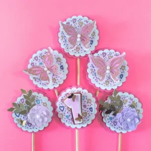 Handmade butterfly cupcake toppers with pastel hues, glitter accents, and floral details—perfect for adding charm to birthdays, baby showers, and special occasions