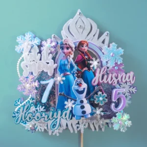 This topper features icy blue and silver hues, shimmering snowflakes, and a magical touch that captures the essence of the beloved Frozen story. Personalizable with two names and ages. The ideal choice for twins or shared celebrations.