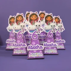 Gabby’s Dollhouse-themed party cone favor box featuring vibrant colors, character illustrations, and customizable text for kids’ birthdays or themed celebrations.