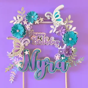 teal and lilac flowers with sparkly butterflies. Personalized with name and age Embelished with pearls. Perfect handmade unique caketopper for kids birthday party.